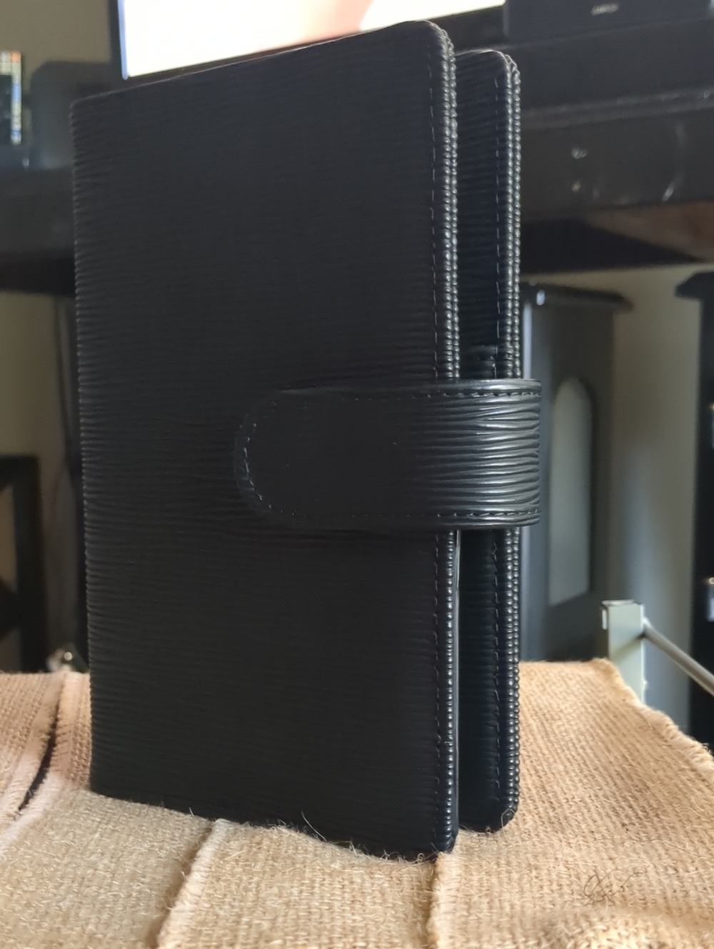 A6 Saffiano Binder In Black With Gold Hardware.